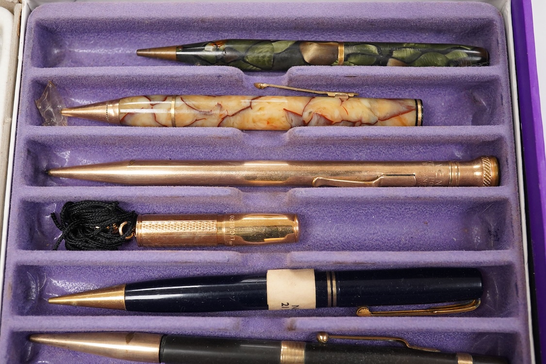 A collection of vintage pencils including an early enamel example